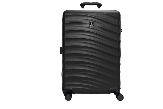 seven carry-on suitcases lined up wheel-to-wheel on a garage floor