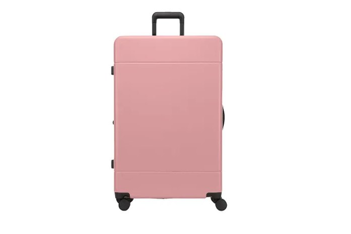 Travelpro Maxlite 5 carry-on next to an airport gate check-in podium