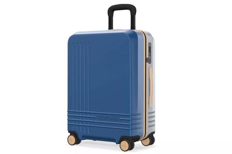 Elegance Carry-On wheeled through an airport corridor