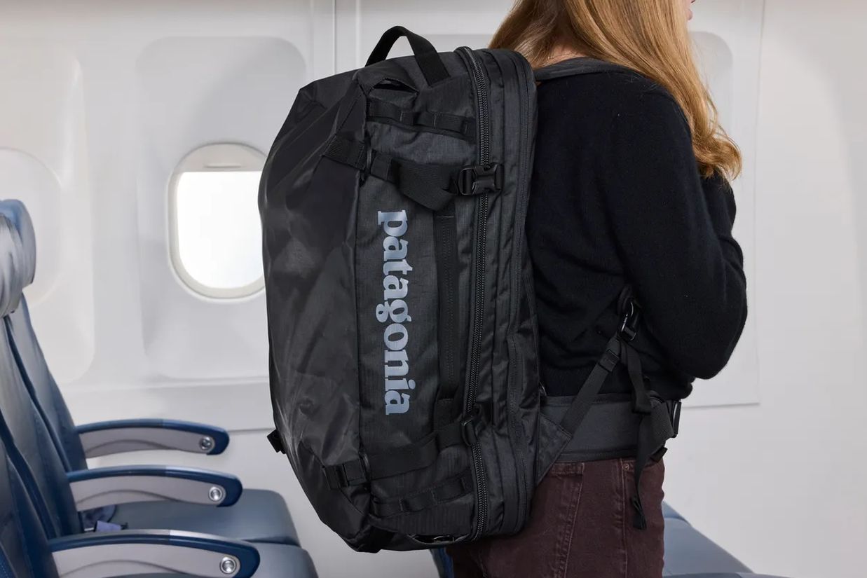 Level8 Grace Carry-On and Monos Carry-On Pro side by side, front pockets unzipped