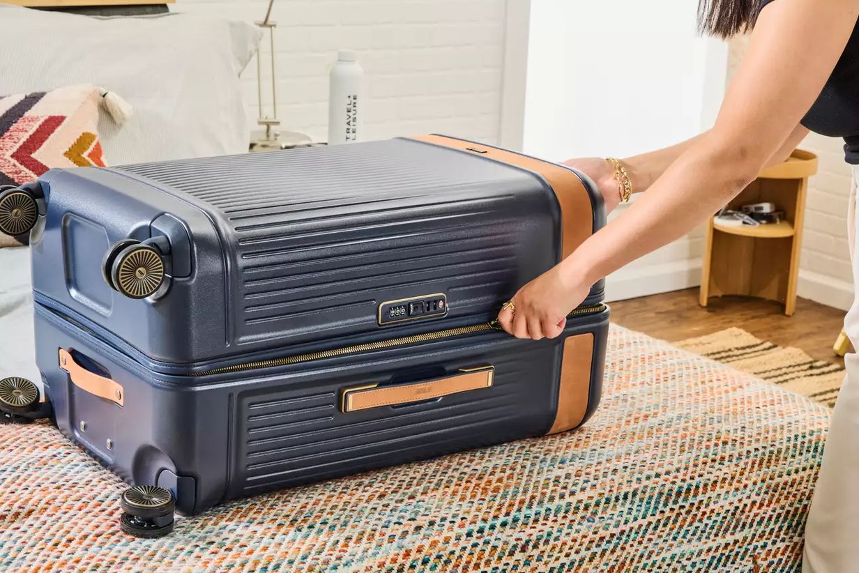 Level8 Carry On and Travelpro Maxlite 5 side by side, wheels facing camera