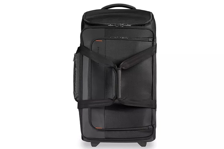Rimowa Essential Cabin standing next to a boarding gate sizer