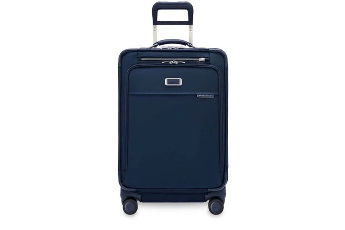 hand lifting the Essential Cabin by its side seam, no bottom handle visible